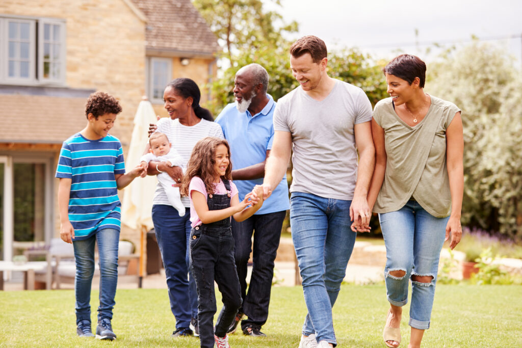 Smiling Multi-Generation Mixed Race Family In Garden At Home Together